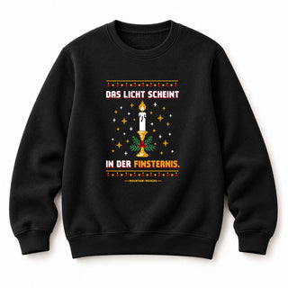 Das Licht scheint in der Finsternis Kerze Christmas Sweatshirt Schwarz